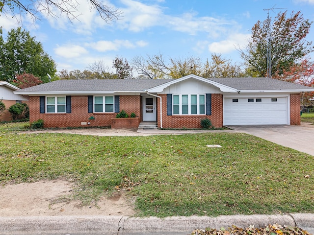 ranch-style house with a front yard and a garage