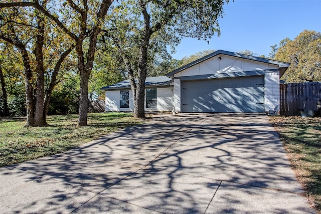 ranch-style home featuring a garage