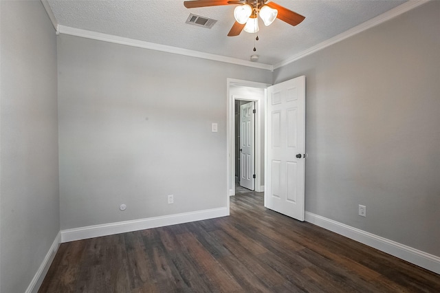 empty room with crown molding, dark hardwood / wood-style flooring, and a textured ceiling