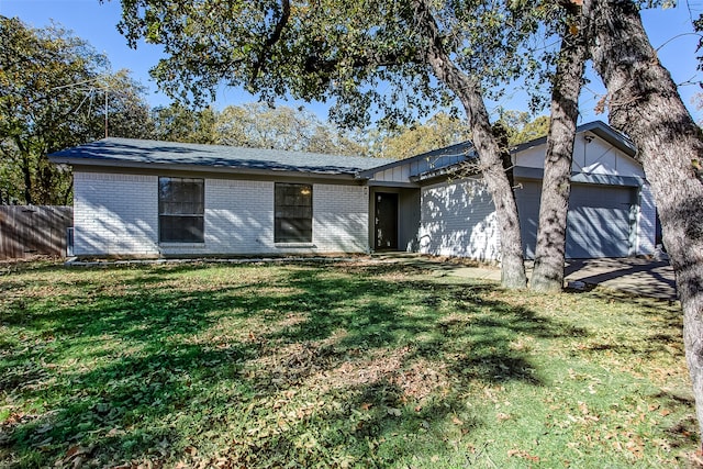 ranch-style house with a front lawn and a garage