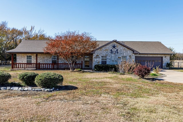 ranch-style home with a garage and a front yard