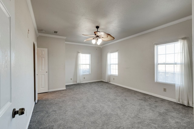 spare room with light carpet, a wealth of natural light, ornamental molding, and ceiling fan