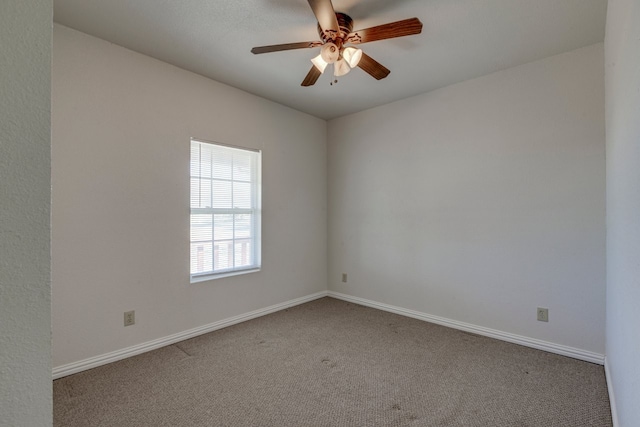 empty room featuring ceiling fan and carpet floors