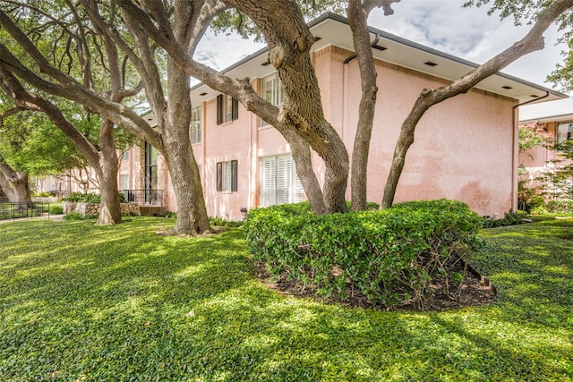 view of property exterior featuring a yard