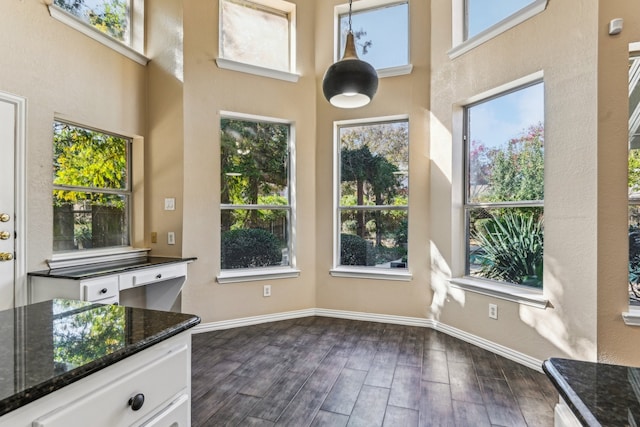 unfurnished sunroom with a wealth of natural light