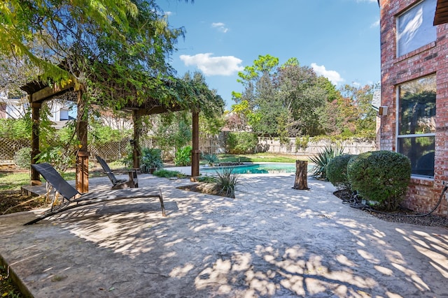 view of patio / terrace featuring a fenced in pool