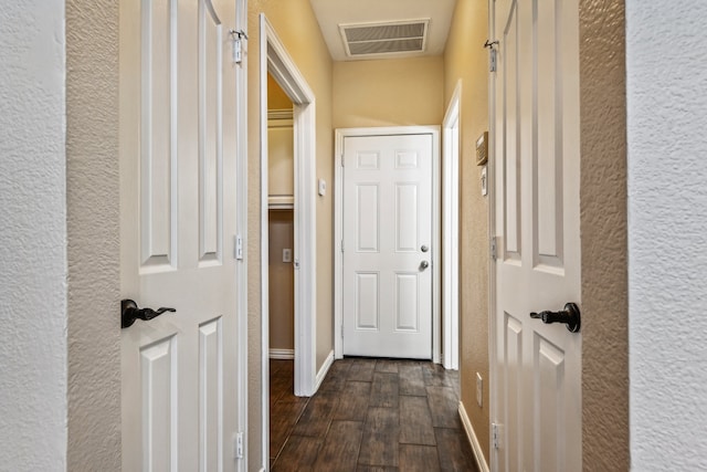 corridor featuring dark hardwood / wood-style flooring