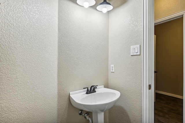 bathroom featuring sink and wood-type flooring