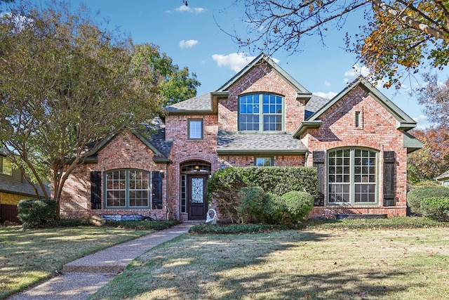 view of property featuring a front yard