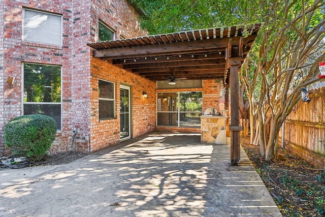 view of patio / terrace with an outdoor kitchen and ceiling fan