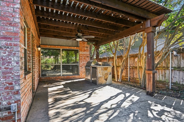 view of patio with area for grilling and ceiling fan