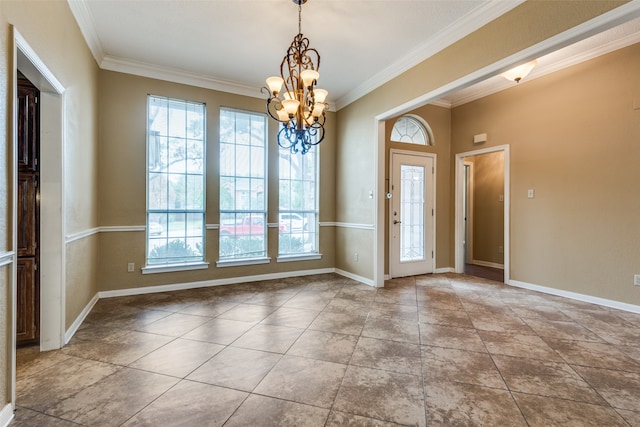 entrance foyer featuring crown molding and an inviting chandelier