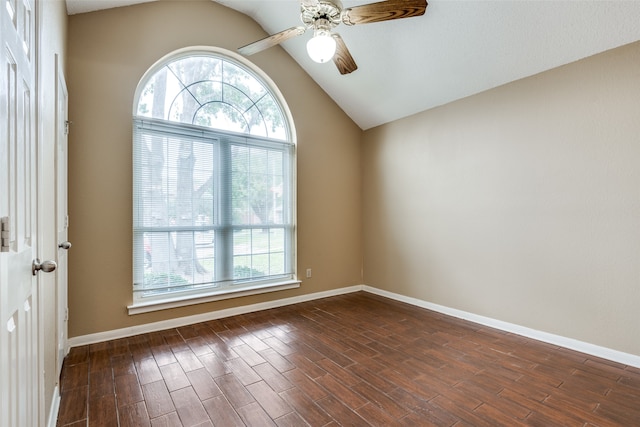 unfurnished room featuring lofted ceiling, ceiling fan, and dark wood-type flooring