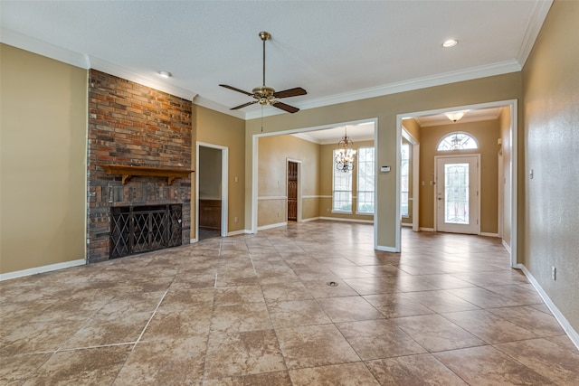 unfurnished living room with crown molding, a fireplace, and ceiling fan with notable chandelier