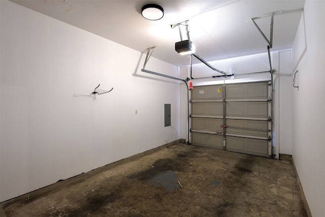 garage featuring electric panel and a garage door opener