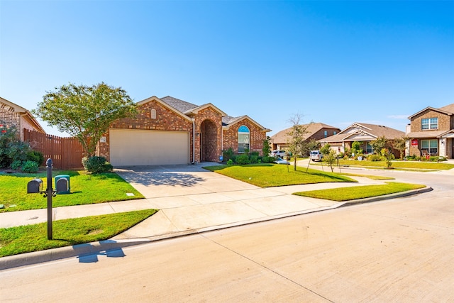 view of front of property with a garage and a front lawn