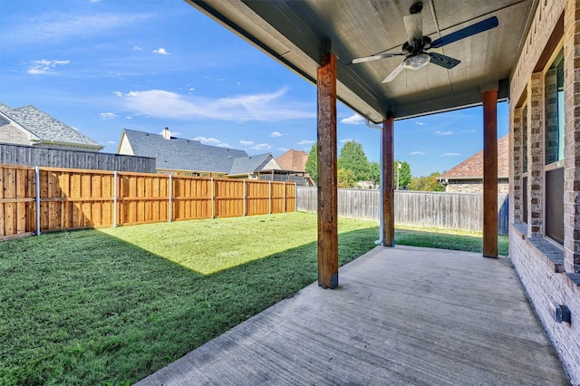 view of yard with ceiling fan