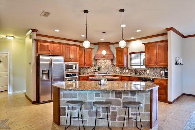 kitchen with a kitchen breakfast bar, a kitchen island, stainless steel appliances, and custom exhaust hood