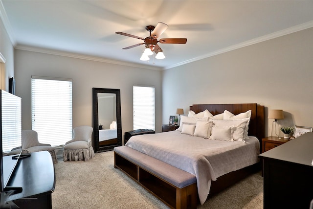 carpeted bedroom with multiple windows, ornamental molding, and ceiling fan