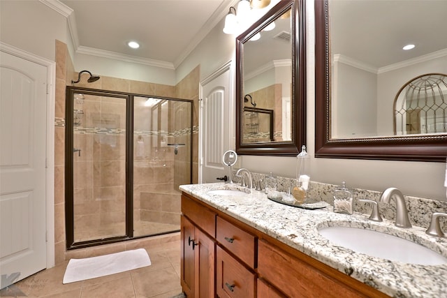 bathroom with tile patterned floors, vanity, and crown molding