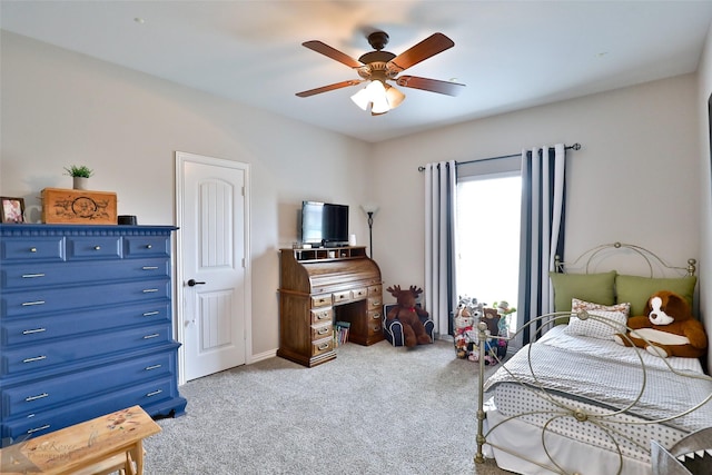 bedroom with ceiling fan and light colored carpet