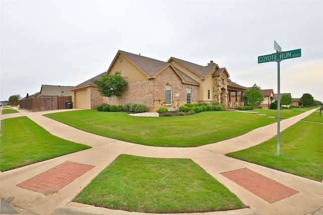 view of front facade with a garage and a front lawn