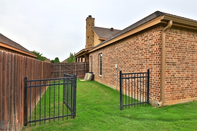 view of home's exterior with a yard