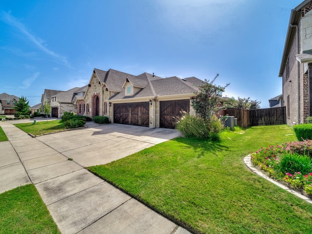 view of front facade featuring a front yard and a garage