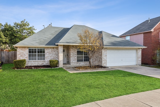 view of front of home featuring a garage and a front lawn