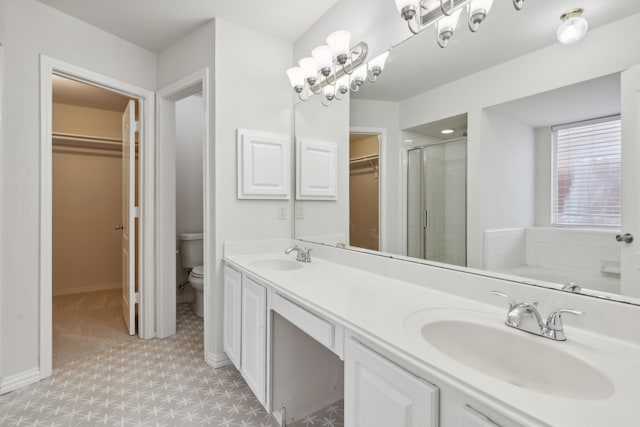 full bathroom featuring vanity, plus walk in shower, and toilet