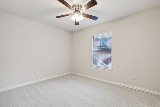 empty room featuring carpet flooring and ceiling fan