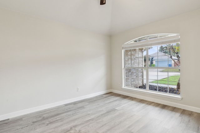 spare room with light hardwood / wood-style floors and ceiling fan