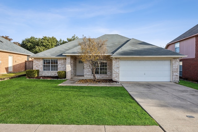 ranch-style home with a front yard and a garage