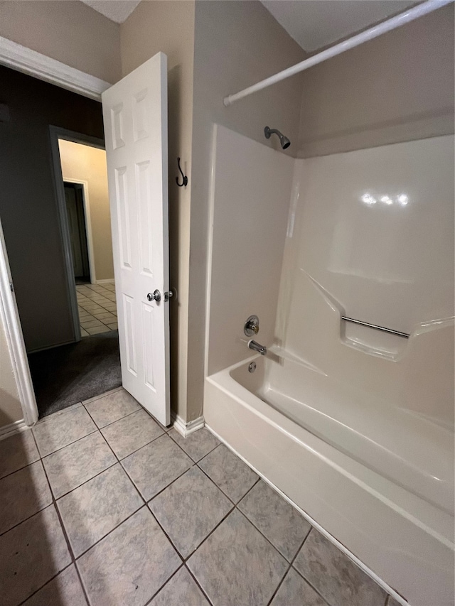 bathroom with tile patterned floors and shower / tub combination