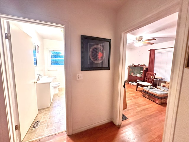 hall with light wood-type flooring