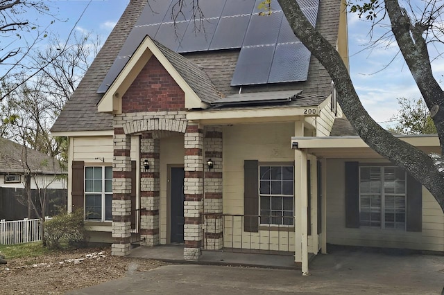 view of front of home featuring solar panels