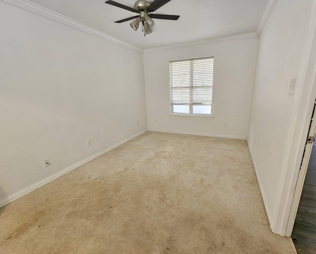 spare room with light carpet, ceiling fan, and ornamental molding