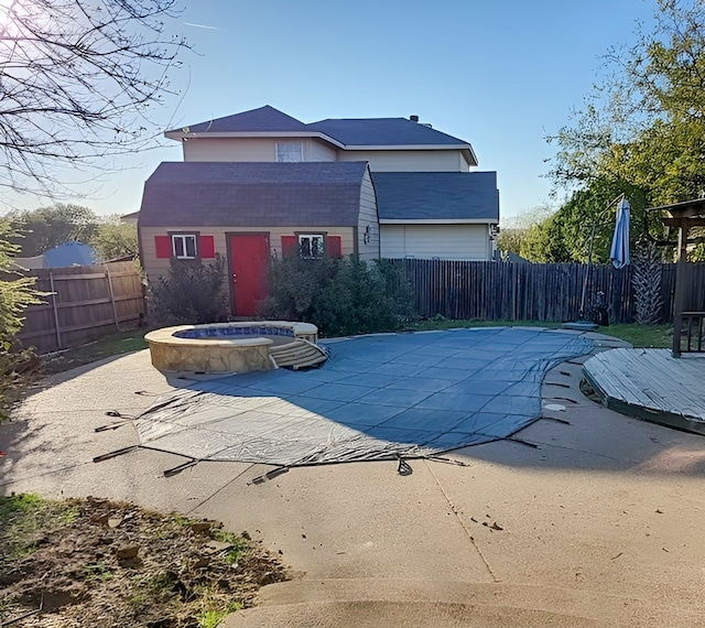 view of pool with an outdoor structure and a patio