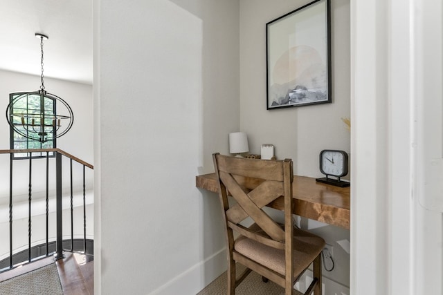 interior space with hardwood / wood-style floors and an inviting chandelier