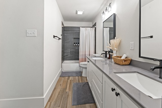 full bathroom featuring shower / bath combination with curtain, vanity, wood-type flooring, and toilet