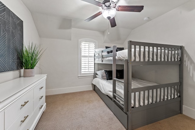 bedroom featuring light colored carpet, ceiling fan, and lofted ceiling