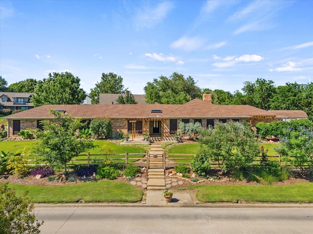 view of front of property with a front lawn