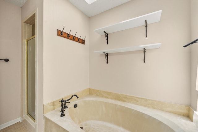 bathroom featuring separate shower and tub and tile patterned floors