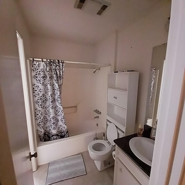 full bathroom featuring vanity, shower / tub combo, and toilet