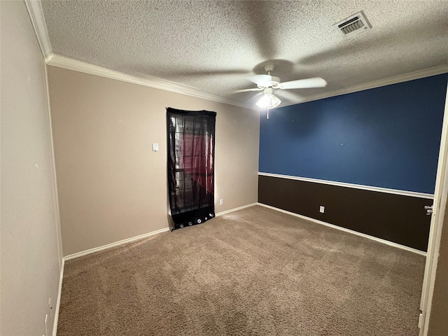 unfurnished room featuring ornamental molding, carpet, a textured ceiling, and ceiling fan