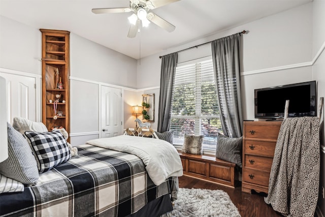 bedroom with dark wood-type flooring, a closet, and ceiling fan