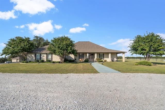 single story home featuring a front lawn