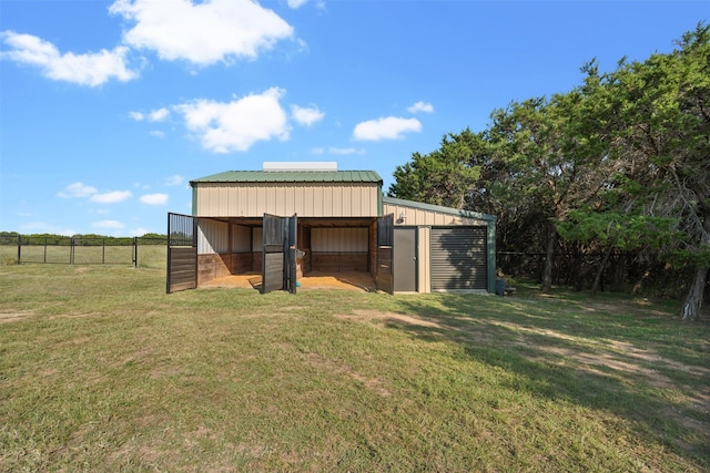 view of outdoor structure with a lawn