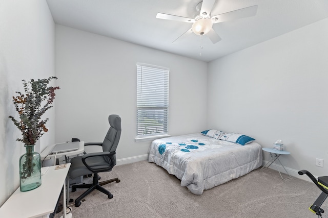 bedroom featuring ceiling fan and carpet