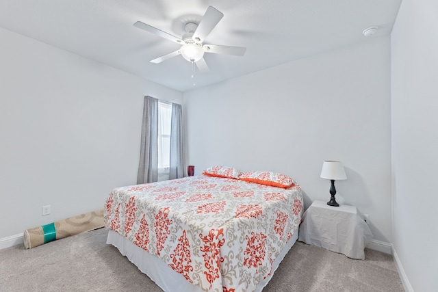 bedroom with ceiling fan and carpet